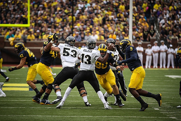 Ben Gedeon (42), Chris Wormley (43), Ryan Glasgow (96), and Mike McCray (9)