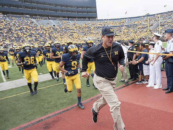 Jehu Chesson (86), Grant Perry (9), and Jim Harbaugh