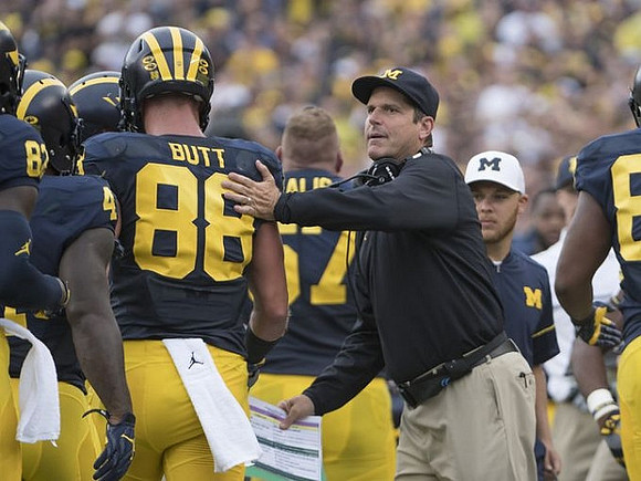 Jake Butt (88) and Jim Harbaugh