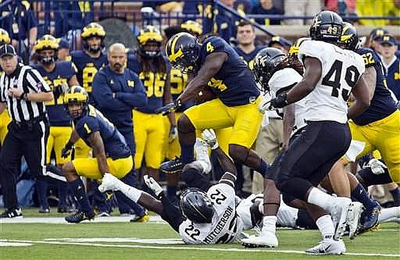 De'Veon Smith (4), Kekoa Crawford (1), and Mason Cole (52)