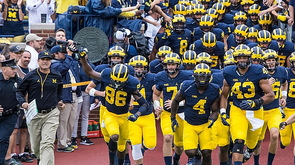 Jim Harbaugh, Jehu Chesson (86), De'Veon Smith (4), and Chris Wormley (43)