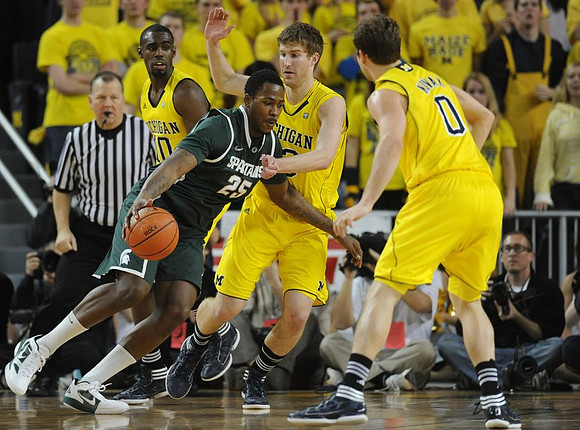Tim Hardaway Jr. (10), Evan Smotrycz (23), and Zack Novak (0)