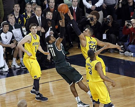 Stu Douglass (1), Jordan Morgan (52), and Trey Burke (3)