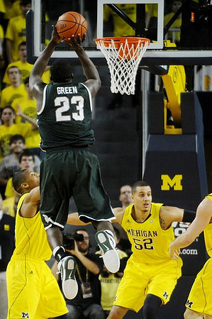 Trey Burke (3) and Jordan Morgan (52)