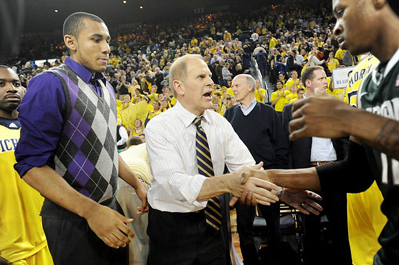Eso Akunne (5), Jon Horford (15), and John Beilein