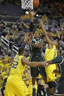 Jordan Morgan (52) and Trey Burke (3)