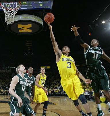 Jordan Morgan (52) and Trey Burke (3)