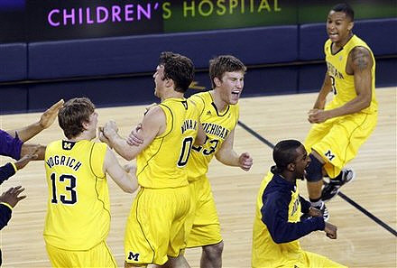 Matt Vogrich (13),  Zack Novak (0), Evan Smotrycz (23), Corey Person (32), and Trey Burke (3)
