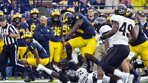 Kekoa Crawford (1), De'Veon Smith (4), and Mason Cole (52)