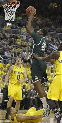 Zack Novak (0), Jordan Morgan (52), and Tim Hardaway Jr. (10)
