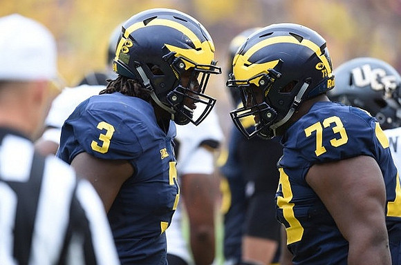 Rashan Gary (3) and Maurice Hurst (73)