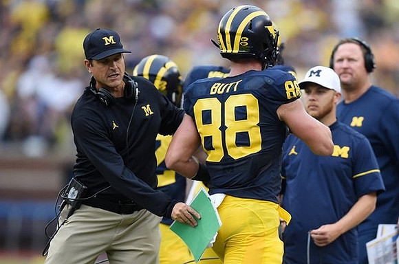 Jim Harbaugh, Jake Butt (88), and Tim Drevno