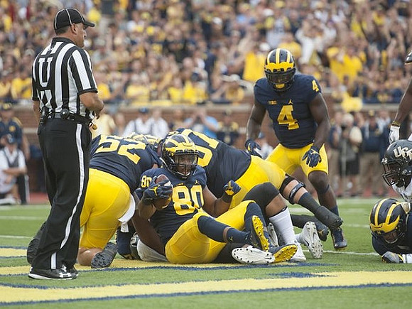 Mason Cole (52), Khalid Hill (80), Kyle Kalis (67), and De'Veon Smith (4)