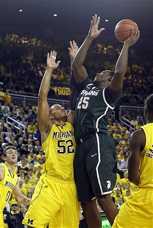 Zack Novak (0), Jordan Morgan (52), and Tim Hardaway Jr. (10)