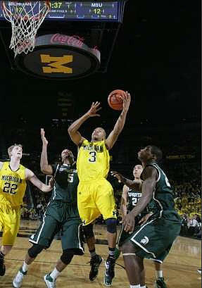 Blake McLimans (22) and Trey Burke (3)
