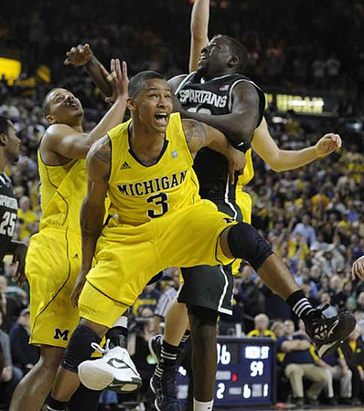 Jordan Morgan (52) and Trey Burke (3)