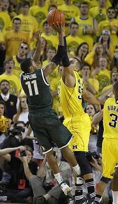 Jordan Morgan (52) and Trey Burke (3)