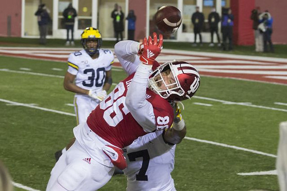 Daxton Hill (30) and Khaleke Hudson (7)