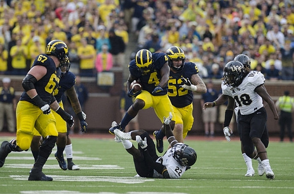 Kyle Kalis (67), De'Veon Smith (4), and Mason Cole (52)