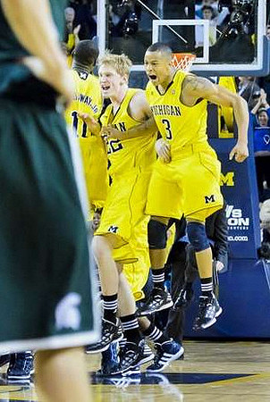 Tim Hardaway Jr. (10), Blake McLimans (22), and Trey Burke (3)