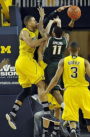 Jordan Morgan (52) and Trey Burke (3)