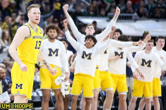 Ignas Brazdeikis (13) and Michigan Team