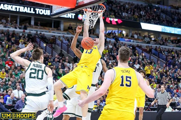 Ignas Brazdeikis (13), Jon Teske (15), and Isaiah Livers (4)