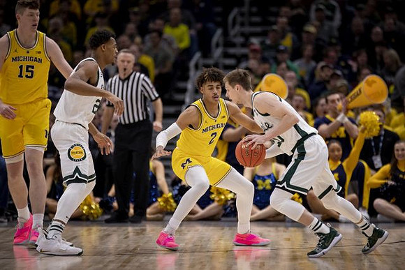 Jon Teske (15) and Jordan Poole (2)
