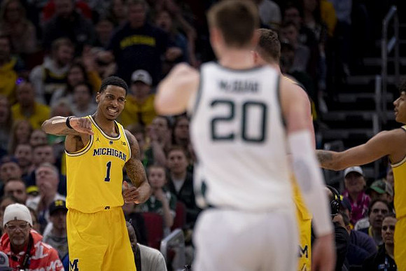 Charles Matthews (1), Jon Teske (15), and Eli Brooks (55)