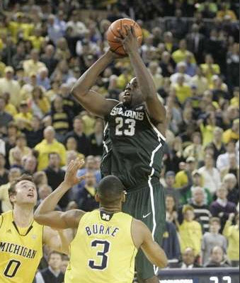 Zack Novak (0) and Trey Burke (3)