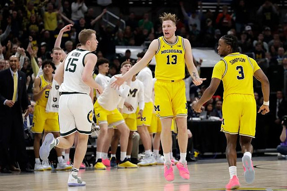 Ignas Brazdeikis (13) and Zavier Simpson (3)