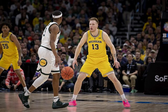 Eli Brooks (55) and Ignas Brazdeikis (13)