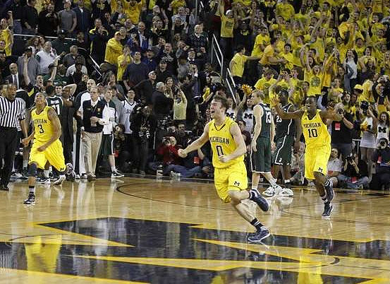 Trey Burke (3), Zack Novak (0), and Tim Hardaway Jr. (10)