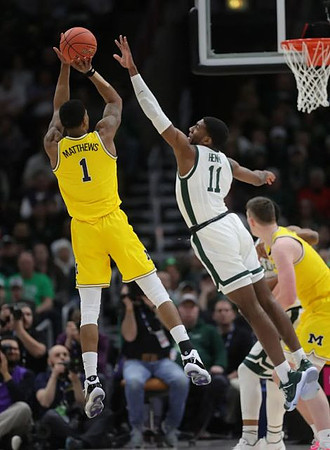 Charles Matthews (1) and Jon Teske (15)