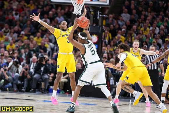 Zavier Simpson (3), Isaiah Livers (4), and Ignas Brazdeikis (13)