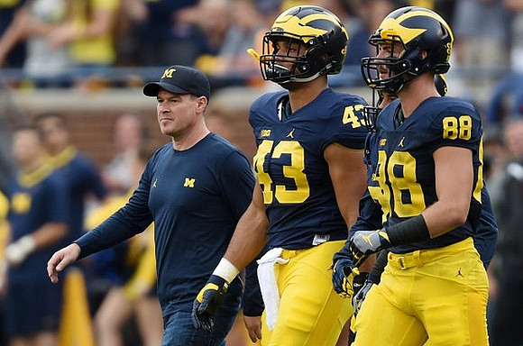 Chris Wormley (43) and Jake Butt (88)
