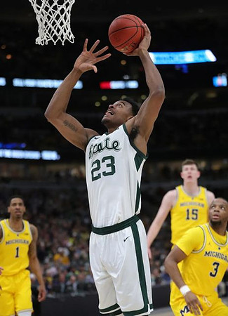 Charles Matthews (1), Jon Teske (15), and Zavier Simpson (3)