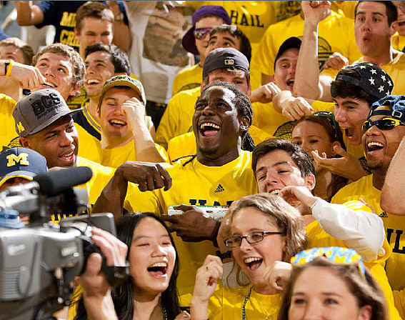 J.B. Fitzgerald, Denard Robinson, and Roy Roundtree