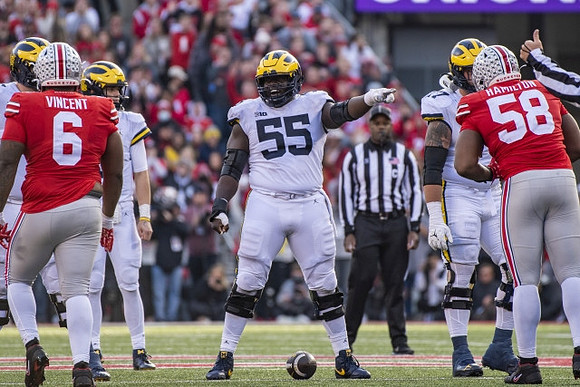 Olusegun Oluwatimi (55), Trevor Keegan (77), and J.J. McCarthy (9)