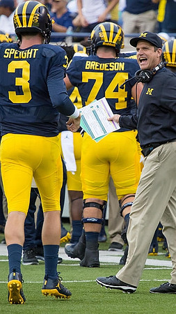 Wilton Speight (3), Ben Bredeson (74), and Jim Harbaugh
