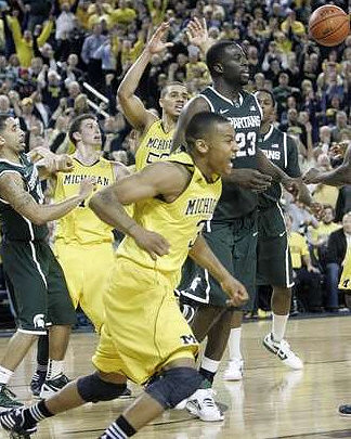 Stu Douglass (1), Jordan Morgan (52), and Trey Burke (3)