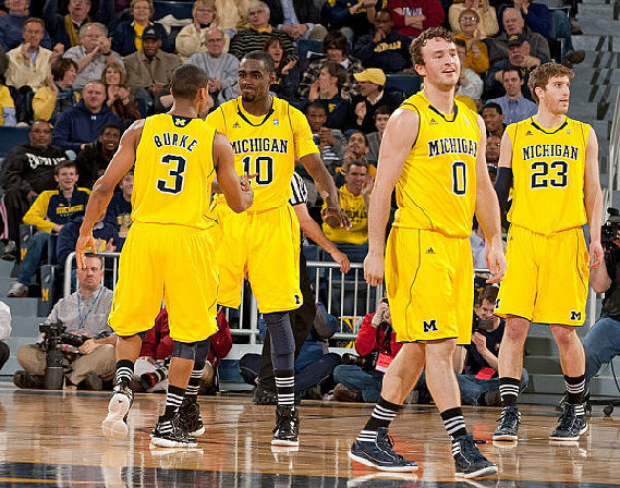 Trey Burke (3), Tim Hardaway Jr. (10), Zack Novak (0), and Evan Smotrycz (23)