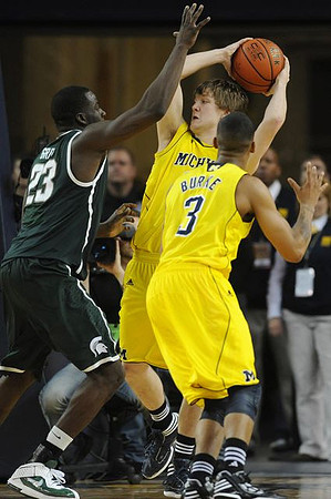 Matt Vogrich (13) and Trey Burke (3)