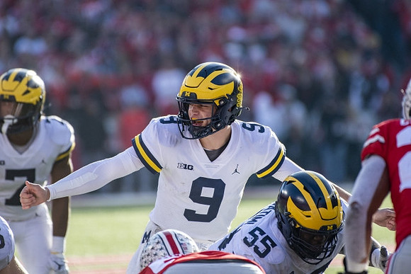 Donovan Edwards (7), J.J. McCarthy (9), and Olusegun Oluwatimi (55)
