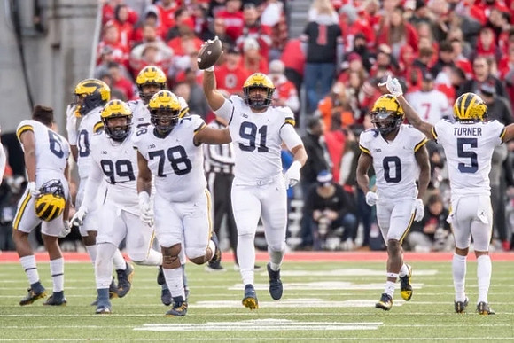 R.J. Moten (6), Cam Goode (99), Kenneth Grant (78), Taylor Upshaw (91), Mike Sainristil (0), and DJ Turner (5)