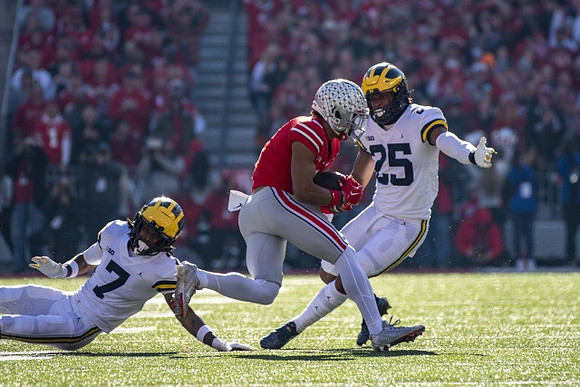 Makari Paige (7) and Junior Colson (25)