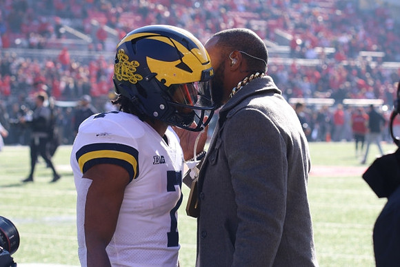 Donovan Edwards (7) and Charles Woodson
