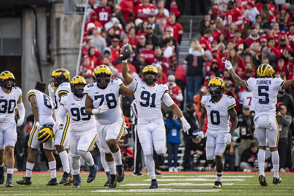 Jimmy Rolder (30), R.J. Moten (6), Cam Goode (99), Kenneth Grant (78), Taylor Upshaw (91), Mike Sainristil (0), and DJ Turner (5)