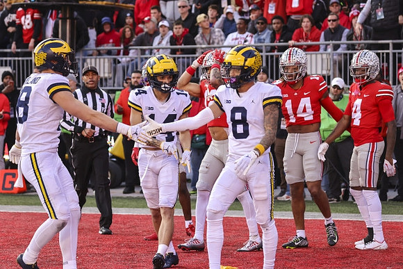 Colston Loveland (18), Roman Wilson (14), and Ronnie Bell (8)