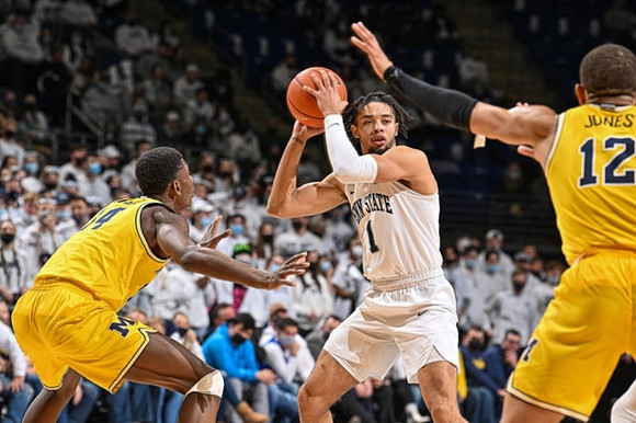 Moussa Diabate (14) and DeVante' Jones (12)